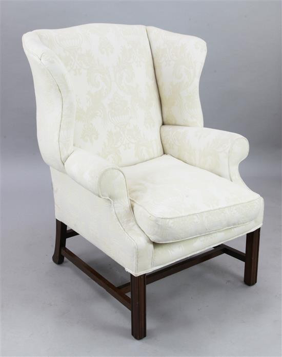 A George III style mahogany wing armchair, W.2ft 7in. H.3ft 8in.
